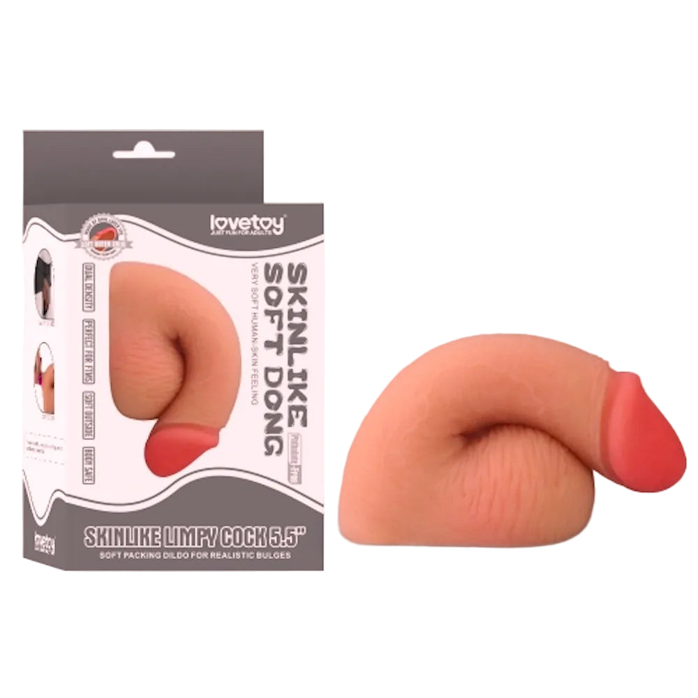 Love toy 5.5 inch dual layer TPE packing penis form the side in a flaccid position sitting next to its box