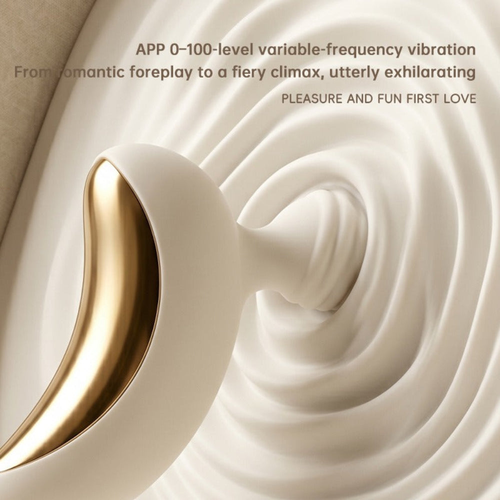 Lunar Curve silicone crescent moon shaped clitoral vibrator in white and gold with app control capability, from the side zoomed in