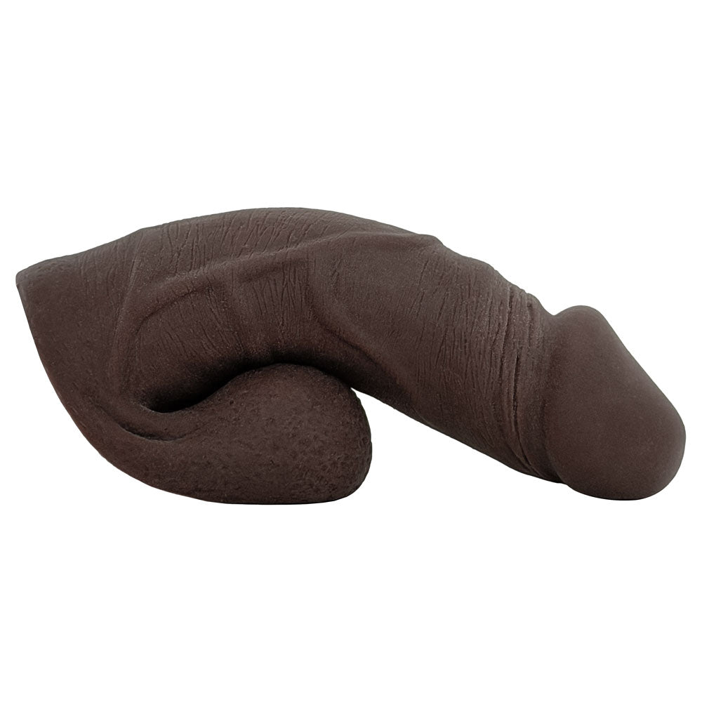 Freeform Medium 5 inch silicone soft ftm packer, in chocolate color from the side, sitting on the balls as a base