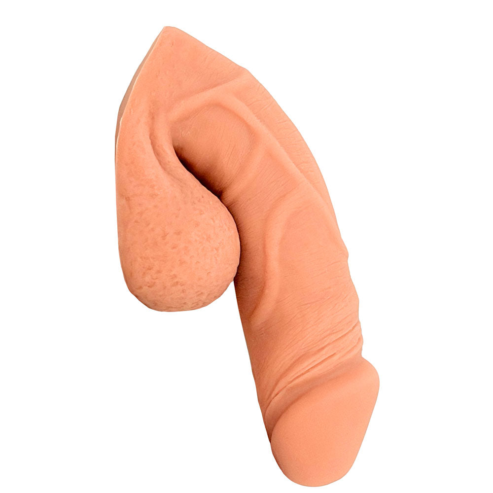 Freeform Medium 5 inch silicone soft ftm packer, in Warm Rosy colors from the side in the flaccid packed position