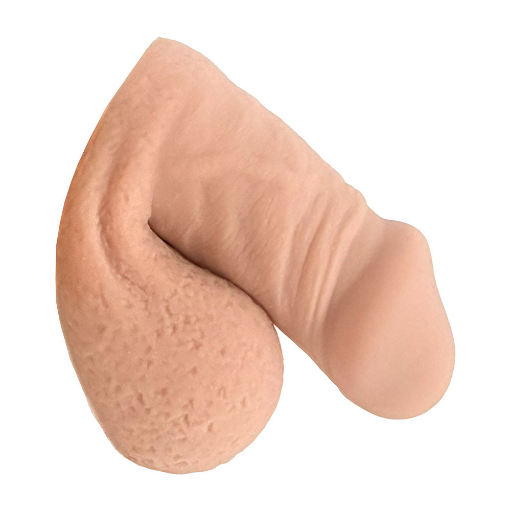 Freeform extra small FTM soft silicone 3 inch packer, in the flaccid packed position from the side, in vanilla color