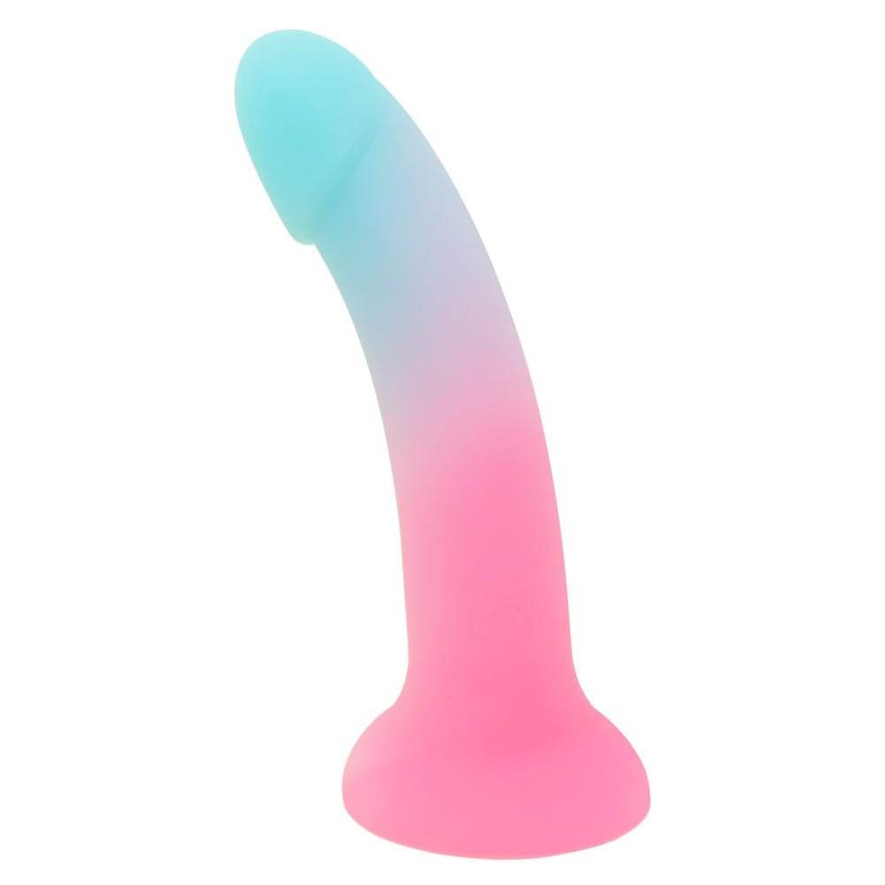 Nexus Sol Sweet tart pink and blue silicone dildo, flat on its suction base, from the side