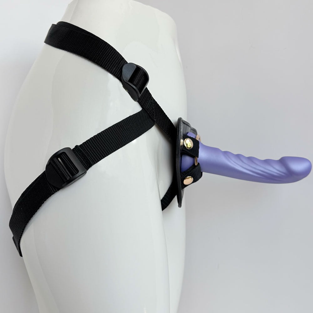 Nexus silicone fun and love harness and silicone dildo set, with purple tease inserted from the side on a manequin
