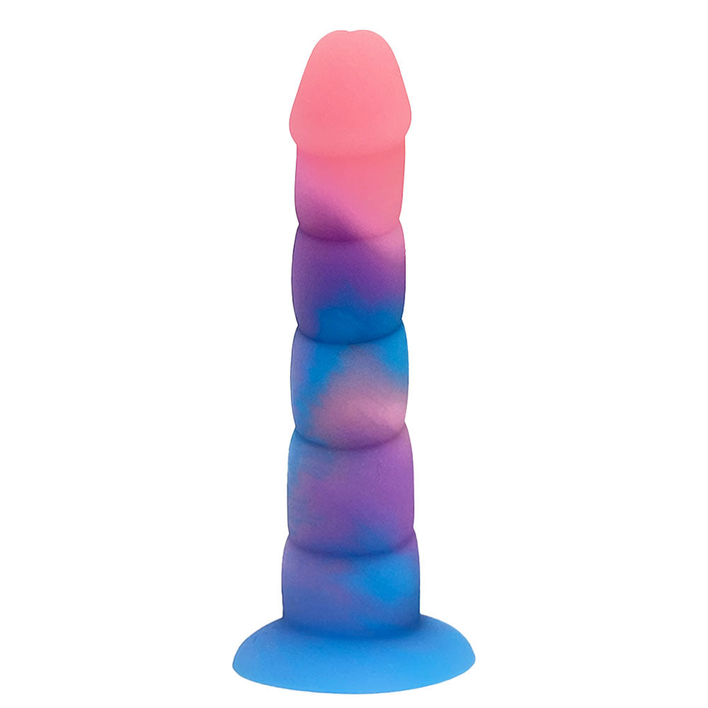 Nexus Loli swirl ribbed silicone dildo in Aurora glow, a pink, blue and purple mix, flat on its suction base, from the top of the shaft