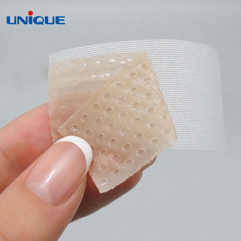 silicone scar tape by unnique, cut into a small piece and being peeled off backing